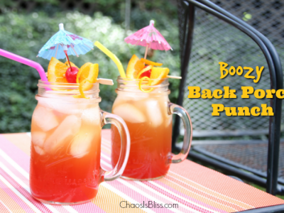 Take that sweet tea up a notch with this Boozy Back Porch Punch, a delicious late summer honey whiskey drink.