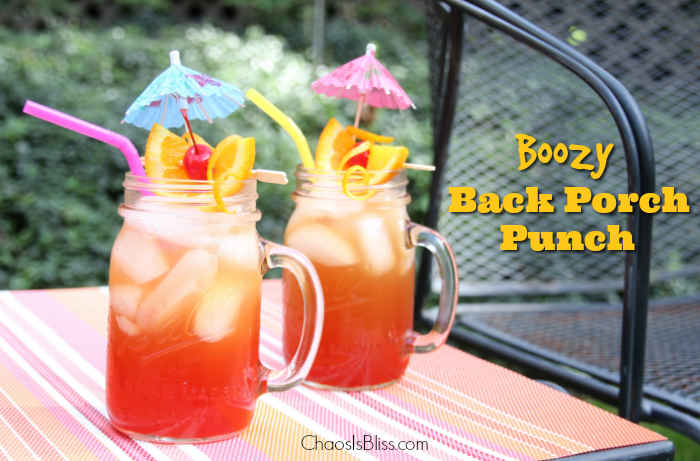 Take that sweet tea up a notch with this Boozy Back Porch Punch, a delicious late summer honey whiskey drink.