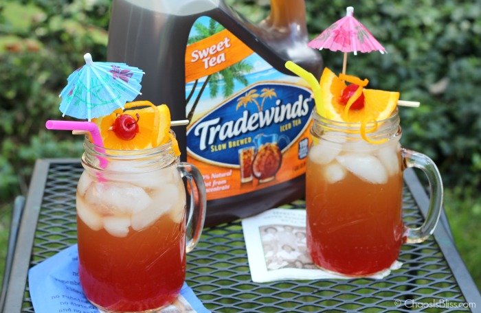 Take that sweet tea up a notch with this Boozy Back Porch Punch, a delicious late summer honey whiskey drink.