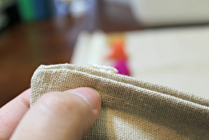 You won't believe how easy it is to make this DIY No Sew Pom Pom Pillow!