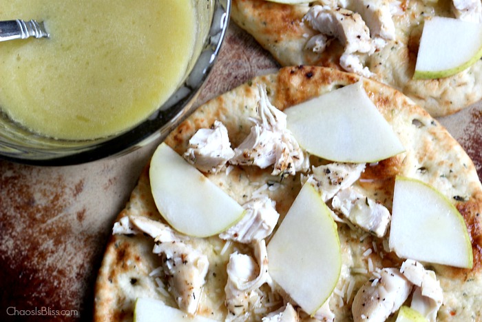 Arugula flatbread with pears, chicken, blue cheese and a made-from-scratch honey lime dressing is an easy dinner recipe for family or friends!