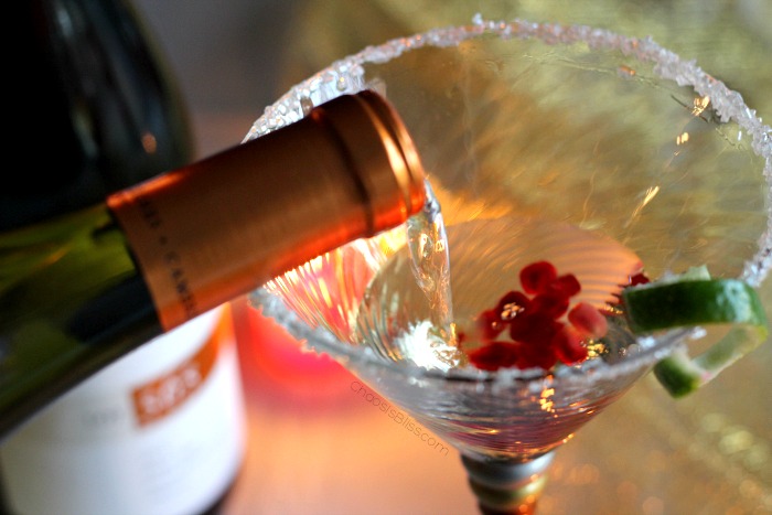 Include a festive holiday cocktail in your party planning, like this Pomegranate Wine Spritzer!