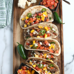 Drop these fresh ingredients into your slow cooker, and a few hours later your family will feast on savory Slow Cooker Pork Tacos!